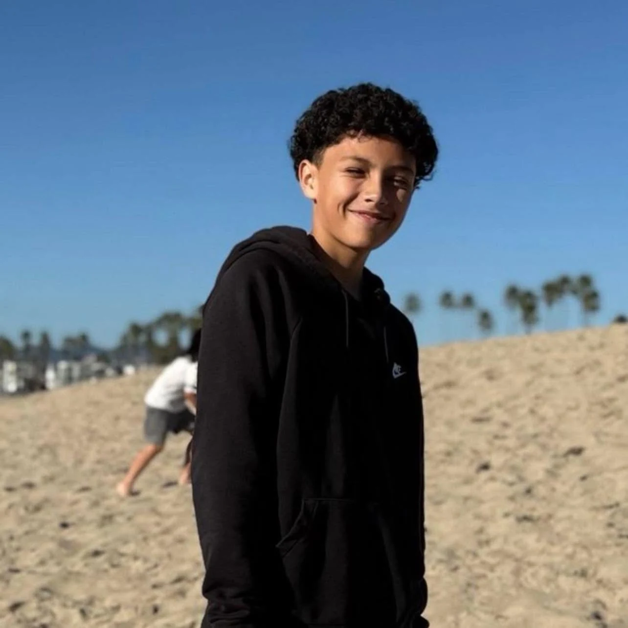 Chris smiling at the beach